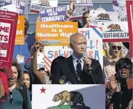  ?? Francine Orr Los Angeles Times ?? STATE Sen. Ed Hernandez, shown at a November rally for access to healthcare, said, “It’s inhumane if we put people in the streets without health insurance.”