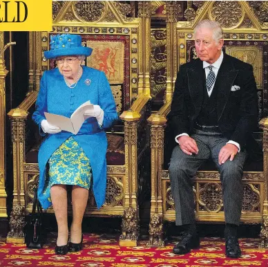  ?? ARTHUR EDWARDS / AFP / GETTY IMAGES ?? Ninety-one-year-old Queen Elizabeth II sits alongside her son Charles, Prince of Wales, as she delivers the throne speech during the ceremonial opening of Britain’s Parliament in London on Wednesday.