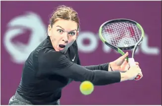  ??  ?? Tough battle: Simona Halep of Romania returning the ball to Julia Goerges of Germany in the quarter-finals of the Qatar Open on Thursday.