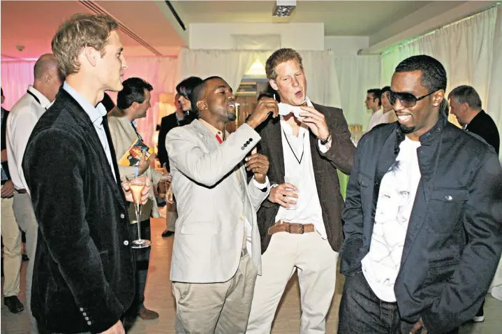  ?? ?? Princes William and Harry attend a reception with P Diddy, right, and Kanye West after the two US rappers had performed at a concert in memory of Diana, Princess of Wales at Wembley stadium in July 2007