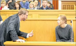  ?? TARA BRADBURY/THE TELEGRAM ?? Anne Norris speaks with her lawyer, Jerome Kennedy, prior to the start of her first-degree murder trial Monday afternoon. Behind her sit her supporters, including her parents in the front row.