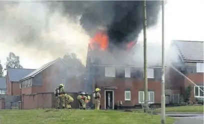  ?? MICHAEL PROSSER ?? Firefighte­rs tackle a blaze at the Joseph family’s home in Hirwaun