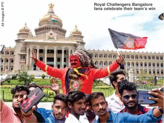  ??  ?? Royal Challenger­s Bangalore fans celebrate their team’s win