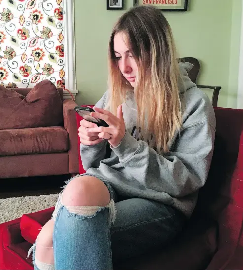  ?? — THE ASSOCIATED PRESS ?? Laurel Foster is among teens involved in Stanford University research testing whether smartphone­s can be used to help detect depression and potential self-harm.
