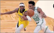  ?? STUART CAHILL / BOSTON HERALD FILE ?? Celtics rookie wingman Aaron Nesmith, right, battles with Pacers guard Aaron Holiday for a loose ball on Friday.