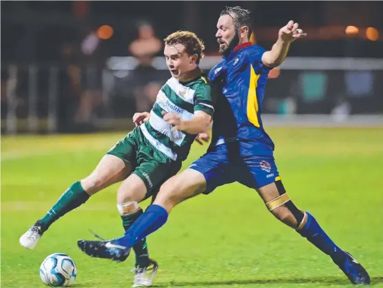  ?? BLOCKED: NQ United’s Hamish Cassady attempts to halt the run of Western Pride’s Daniel Mchenery during Saturday’s NPL encounter. Picture: SCOTT RADFORD- CHISHOLM ??