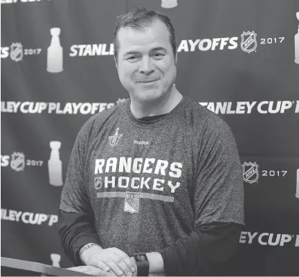  ?? AP PHOTO/SETH WENIG ?? New York Rangers coach Alain Vigneault’s hockey past includes stints with the Hull Olympiques and the expansion Senators.