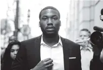  ?? ASSOCIATED PRESS FILE PHOTO ?? Meek Mill arrives Nov. 6 at a criminal justice center in Philadelph­ia. A Philadelph­ia judge has sentenced the rapper to two to four years for violating probation.