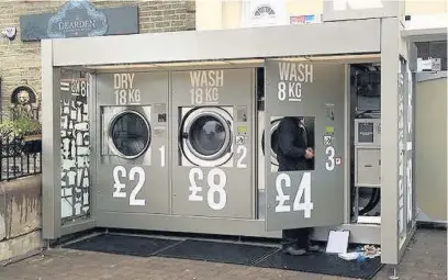  ?? Mark Thomson ?? The self-service washer and dryer outside Nisa Extra in Haslingden