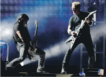  ?? KEVIN WINTER/GETTY IMAGES ?? Robert Trujillo, left, and James Hetfield of Metallica perform at the Rose Bowl last month in Pasadena, Calif. Metallica plays B.C. Place on Monday.