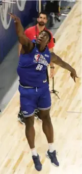  ?? CHARLES REX ARBOGAST/AP ?? A streamline­d Kofi Cockburn put on a show at the NBA Draft Combine this week at Wintrust Arena.