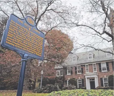  ?? Picture: AP ?? FAMILY TIES: A blue state historical marker sits outside actress Grace Kelly's family's home in Philadelph­ia, which was recently bought by her son, Prince Albert of Monaco.