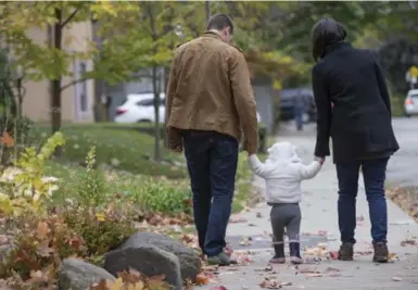  ?? RICK MADONIK/TORONTO STAR ?? James, left, and Janis had to rethink their finances after Janis’ maternity leave reduced their income.