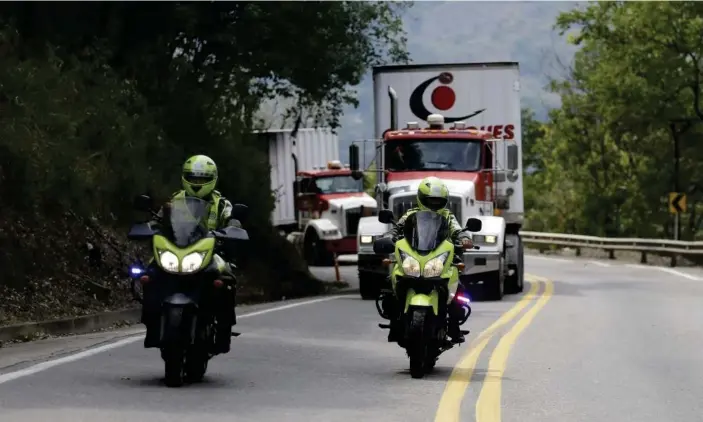  ??  ?? Two semi-trailer trucks containing humanitari­an aid from the US for Venezuela are escorted by Colombian police in Los Patios, near Cúcuta, Colombia, on Thursday. Photograph: Fernando Vergara/AP