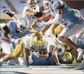  ?? Robert Willett / Associated Press ?? Notre Dame’s Kyren Williams scores on a 1-yard carry against North Carolina on Friday in Chapel Hill, N.C.