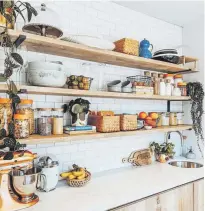  ?? WORDS: JOSIE COPSON GET THE LOOK COMPILED BY: VICTORIA GRAY ?? The couple like a well-organised home, which is abundantly clear from these orderly kitchen shelves. The trailing plants are a nice touch too.