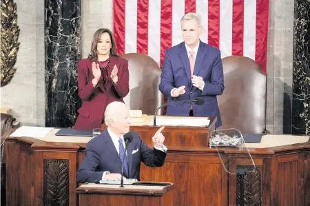  ?? PATRICK SEMANSKY AP ?? President Joe Biden arrives to deliver the State of the Union address to a joint session of Congress at the U.S. Capitol on Tuesday in Washington. Vice President Kamala Harris and House Speaker Kevin McCarthy, R-Calif., applaud in the background.