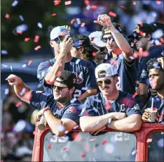  ?? ASSOCIATED PRESS FILE PHOTO ?? Mississipp­i baseball players celebrate its College World Series national championsh­ip in a parade in Oxford, Miss. last year.