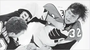  ?? ASSOCIATED PRESS FILE PHOTO ?? In this 2008 photo, Pittsburgh Penguins’ Eric Godard, left, and Philadelph­ia Flyers’ Riley Cote fight. Now, a handful of years into retirement, Cote is a proponent of cannabis and its oils as an alternativ­e to more addictive drugs commonly used by athletes to play through pain.