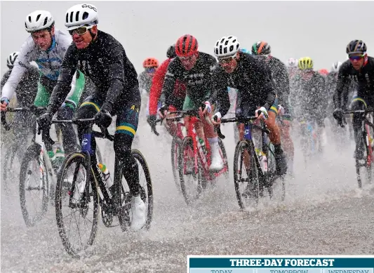  ??  ?? Rinse cycle: Road racing in the Yorkshire Dales yesterday