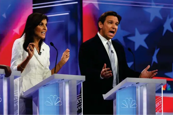  ?? Photograph: Joe Raedle/Getty Images ?? Nikki Haley and Ron DeSantis during a debate in Miami, Florida, on 8 November 2023.