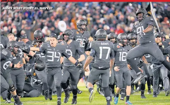  ?? PAUL W. GILLESPIE/BALTIMORE SUN MEDIA GROUP ?? ARMY WEST POINT 21, , NAVY 17 Army celebrates after beating Navy at M&T Bank Stadium. The Mids trailed by two touchdowns in the first half, then rallied to take the lead but lost to the Black Knights for the first time since 2001.