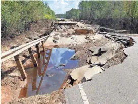  ?? SERVICE WILMINGTON CARL MORGAN/NATIONAL WEATHER ?? Extreme rainfall from Hurricane Florence in 2018 washed out this section of North Carolina Highway 210 at Moore’s Creek.