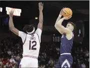  ?? YOUNG KWAK – THE ASSOCIATED PRESS ?? Yale guard John Poulakidas, who scored 28 points, shoots against Auburn guard Denver Jones on Friday.