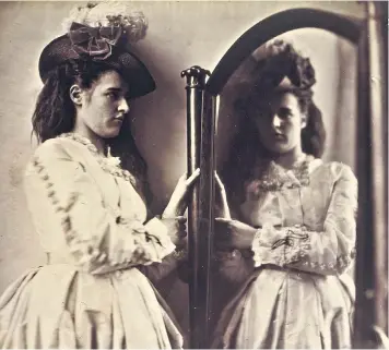  ??  ?? Scientific art: Clementina Maude looking into a large mirror c1863-4, by Clementina, Lady Hawarden; left, Lewis Carroll; right, Sadness, 1864, by Julia Margaret Cameron