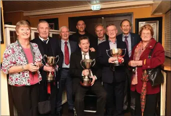  ??  ?? Members of the Mid Kerry 1969 Kerry county Champions Jerry Riordan, Kevin Griffin, Pat Griffin, Jimmy Healy, Mike O’Grady and Teddy Bowler from Glenbeigh with Kathleen Moynihan and Mary O’Shea nee Griffin and the Kerry County Junior Cup, Munster Junior...