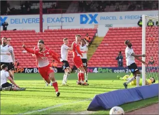  ?? ?? Top form: Adam Phillips scores and celebrates.