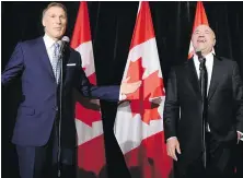  ??  ?? Conservati­ve leadership candidate Maxime Bernier cracks up former rival Kevin O’Leary at the Toronto news conference where O’Leary threw in the towel on Wednesday.