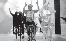  ?? PHOTOS BY MIKE STOCKER/STAFF PHOTOGRAPH­ER ?? The first pack of bicyclists cross the finish line during the Dolphins Cancer Challenge at Hard Rock stadium.