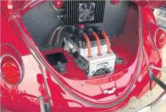  ??  ?? An electric motor in a Volkswagen Beetle.
