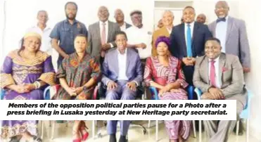  ?? ?? Members of the opposition political parties pause for a Photo after a press briefing in Lusaka yesterday at New Heritage party secretaria­t.