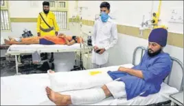  ?? SAMEER SEHGAL/HT ?? Nihangs injured in firing between two groups at Baba Bakala being treated at Guru Nanak Dev Hospital in Amritsar on Monday.