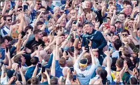  ?? ?? HERO: Barton is held aloft by Bristol Rovers fans at the Memorial Ground