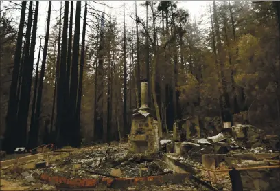  ?? NHAT V. MEYER — BAY AREA NEWS GROUP ?? File photo of what is left of the Nature Lodge Museum and Store in Big Basin Redwoods State Park after the CZU Complex fire destroyed many of the park’s historical structures in Boulder Creek, Calif., on Thursday, Sept. 10, 2020.