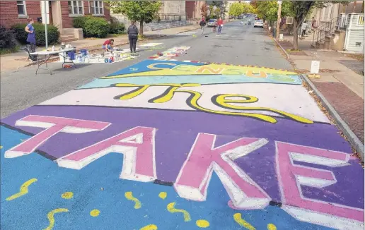  ?? Paul Buckowski / Times Union ?? Neighbors come out Monday to take part in a mural project on Sixth Street in Troy to promote census participat­ion. The mural project was organized by the Rensselaer County Complete Count Committee, the Arts Center of the Capital Region, and the city of Troy.