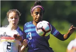  ?? PATRICK MCDERMOTT GETTY IMAGES ?? Stanford defender Naomi Girma (3) playing for the U.S. against Alicia-sophie Gudorf and Germany in an U-20 friendly, was selected first in the NWSL Draft.