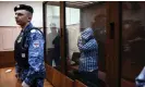  ?? AFP/Getty Images ?? One of the men suspected of taking part in the attack on the Crocus City Hall waiting for his pre-trial detention hearing at a court in Moscow. Photograph: Tatyana Makeyeva/