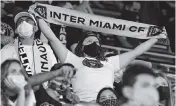  ?? DAVID SANTIAGO dsantiago@miamiheral­d.com ?? Inter Miami fans show their support during the second half of an MLS match against Atlanta United FC at Inter Miami Stadium on Oct. 14, 2020, in Fort Lauderdale. It was the first home game with any fans in the stands.