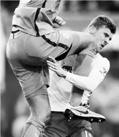  ??  ?? Leipzig’s forward Timo Werner (right) and Wolfsburg’s Belgian goalkeeper Koen Casteels vie for the ball during the German Bundesliga football match in Leipzig, eastern Germany in this March 11 file photo. — AFP photo