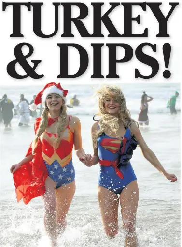  ??  ?? Wonder Woman Stephanie Jones and Superwoman Caroline Power enjoying last year’s Christmas Day swim at Porthcawl