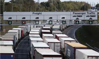  ??  ?? Lorries queue at the entrance to the Channel tunnel in Folkestone. Photograph: Gareth Fuller/PA