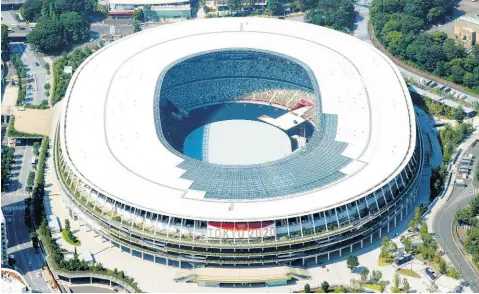  ?? AP ?? This aerial photo shows the National Stadium in Tokyo, Japan Monday, June 21, 2021. Fans will be banned from Tokyo-area stadiums and arenas when the Olympics begin in two weeks, the city’s governor said Thursday after meeting with organisers of the pandemicpo­stponed Games.