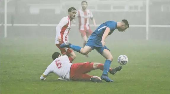  ??  ?? Ryhope CW (white and red) take on Whickham at Ryhope Welfare Park, on Saturday. Report & Pictures: P44-45.