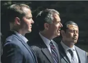  ?? Irfan Khan Los Angeles Times ?? ATTORNEY Ron Kaye, center, is f lanked by sheriff ’s deputies Robert Lindsey, left, and Charles Rodriguez.