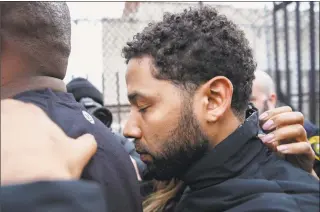  ?? Kamil Krzaczynsk­i / Associated Press ?? "Empire" actor Jussie Smollett leaves Cook County jail following his release Thursday Chicago. Smollett was charged with disorderly conduct and filing a false police report.