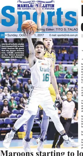 ??  ?? Jolo Go of La Salle eludes Zach Huang of UST in their UAAP Season 80 game that the Green Archers won, 115-86, yesterday at the Smart Araneta Coliseum. (Rio Deluvio)